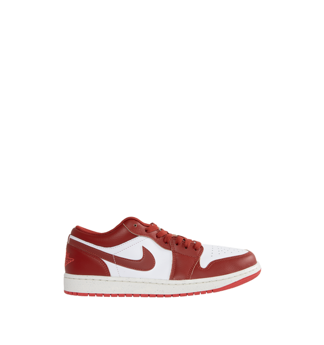 Image 1 of 5 - RED - AIR JORDAN 1 low-top lace-up sneakers crafted from leather and textiles in the upper for durability and structure and Nike Air-Sole unit for lightweight cushioning.Rubber in the outsole gives you traction on a variety of surfaces. Features stitched-down Swoosh logo and Jumpman Air design on tongue. 