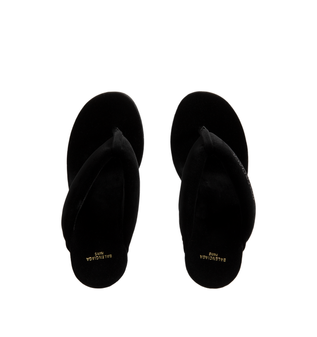 Image 4 of 4 - BLACK - Balenciaga Womens Gaeta Wedge Thong Sandals are crafted from a plush stretch velvet material. Feature a round toe, padded thong strap, slip-on design, 90mm arch wedge heel, and leather sole. Upper: cotton, viscose, elastane, Sole: calfskin, Insole: cotton, viscose, elastane. Made in Italy.