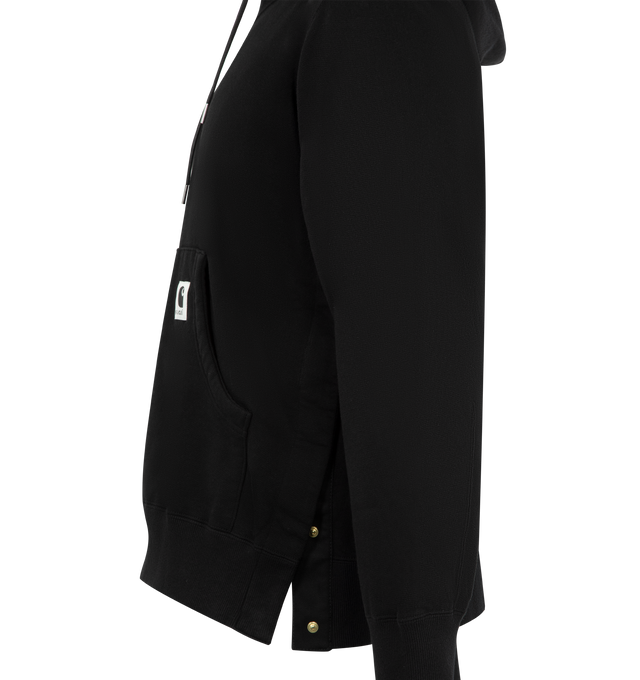 Image 3 of 3 - BLACK - SACAI X CARHARTT WIP Cotton Hoodie featuring a heavyweight cotton jersey fabric with a soft, brushed cotton pile lining, garment-washed for a unique, worn-in appearance, hooded drawstring neckline, kangaroo pocket with co-branded woven label, long sleeves, ribbed cuffs and hem and pullover style. Cotton/polyurethane. Made in Japan.