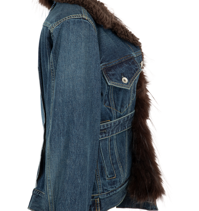 Image 3 of 3 - BLUE - Sacai Women's faux fur-trimmed cinched denim jacket featuring an asymmetric button placket and a plush black collar. Material: Cotton Denim, Polyester Faux Fur.