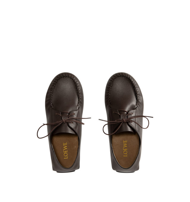 Image 4 of 4 - BROWN - Loewe Boat shoe in soft calfskin made in a classic moccasin construction, featuring a round toe shape, waxed laces and hand-stitched details around the upper. Square lace closure, embossed Anagram on the upper, padded leather insole, suede lining, injected rubber outsole with Anagram cut-out detail. Made in Italy.