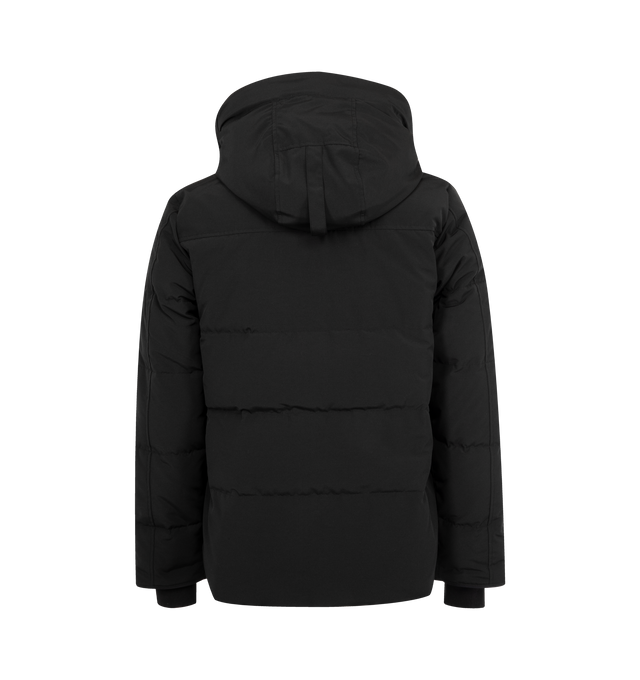 Image 2 of 3 - BLACK - CANADA GOOSE MacMillan Parka featuring adjustable down-filled Snorkel hood, hood features a removable zipper guard for the option of changing your hood trim for a customized look and added protection, chin guard is lined with tricot fabric, sleek interior hanging lining with backpack straps, placket with snap closures over 2-way zipper, storm flap underneath 2-way zipper, sleeve cuffs reinforced with CORDURA fabric, sip-length, cut longer in the back, 2 exterior fleece lined front poc