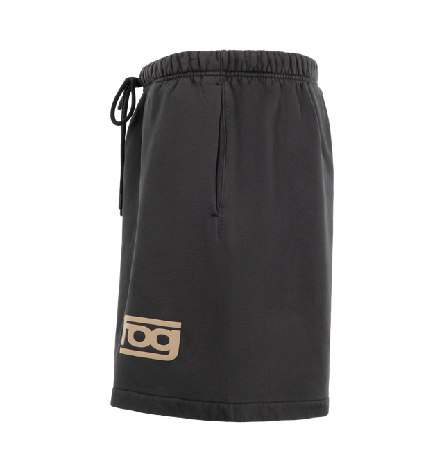 Image 3 of 3 - BLACK - Fear of God ESSENTIALS Men's Classic Sweatshort is crafted from pigment-dyed heavyweight 480 GSM cotton-blend fleece and features a relaxed, slouchy silhouette inspired by vintage athletic wear. Designed with a FOG puff-print graphic at the leg, this elevated everyday short is finished with an encased elastic waistband, heavyweight drawstring, side-seam pockets, and a signature Essentials label at the center front. Main Material: 80% Cotton, 20% Polyester Fleece, 480 GSM.