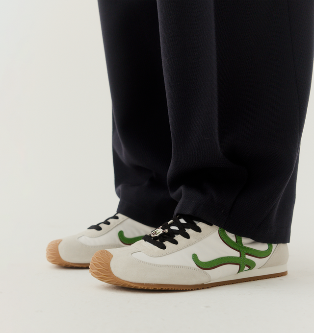 Image 2 of 6 - WHITE - LOEWE Ballet Runner 2.0 in nylon and calfskin featuring a hand-finished Louis Wain cat lace charm, asymmetrical toe shape, sock-like internal structure, a lightweight rubber outsole that extends to the toecap, shadow-effect L monogram at the side, embossed Anagram on the tongue and injected rubber LOEWE on the heel tab. Nylon/calf. Made in Italy.