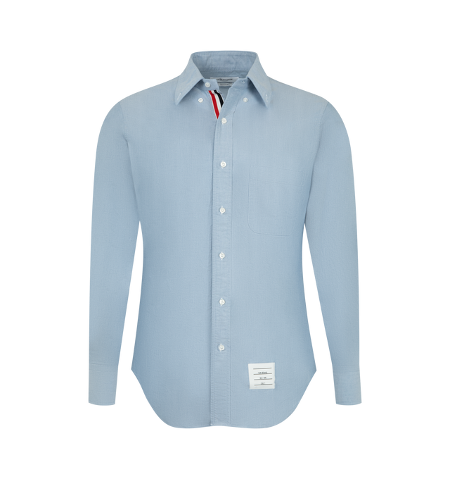 Image 1 of 2 - BLUE - Thom Browne Mens Oxford Shirt is crafted from cotton Oxford cloth. Features a button-front closure with signature striped grosgrain placket, button-down collar, long sleeves with buttoned cuffs, name tag appliqu above the hem, seamed back yoke with locker loop, and a curved hem. Main Material: 100% Cotton. Made in Italy.