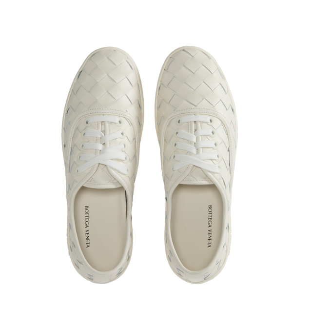 Image 5 of 5 - WHITE - BOTTEGA VENETA Sawyer Sneakers featuring lace-up closure, logo flag at side, buffed calfskin and suede lining, logo embossed at textured rubber midsole and treaded rubber sole. Upper: calfskin. Sole: rubber. Made in Italy. 