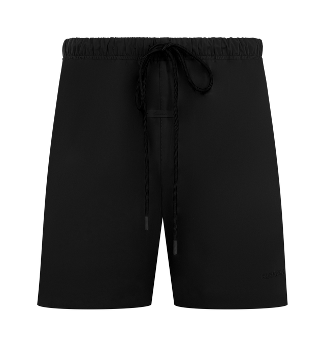 Image 1 of 3 - BLACK - FEAR OF GOD ESSENTIALS Active Trace Relaxed Short featuring a perforated lining for enhanced breathability, a voluminous, elongated silhouette, 3M Embroidered Essentials Active Trace logo divided across both legs, Essentials signature label is positioned at the center front, side pockets, leg slits and an encased elastic waistband with drawstrings. 100% polyester.