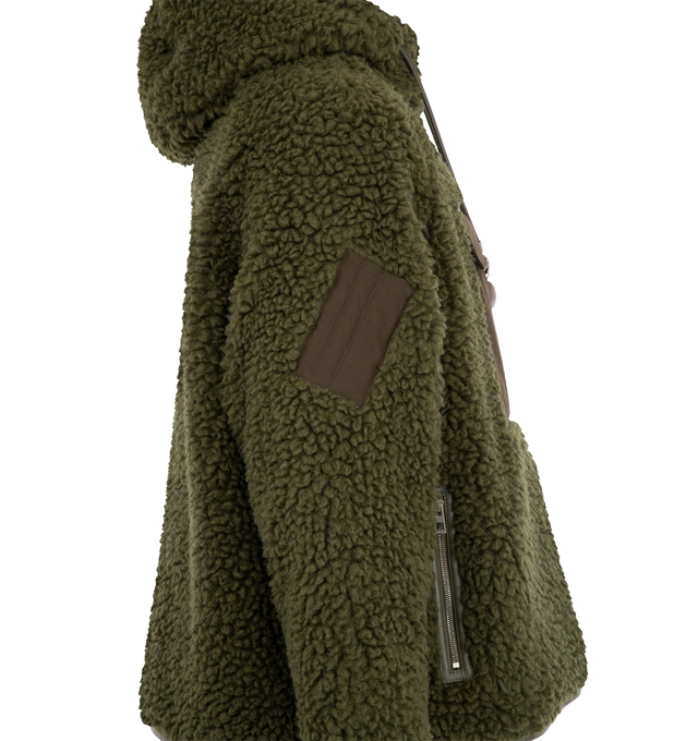 Image 3 of 3 - GREEN - Loewe Anorak is crafted from medium-weight khaki green polyester-and-wool fleece and features a relaxed fit with a regular length and zippered hooded collar. A leather drawstring with detachable whale and bottle-opener details, a contrasting front snap-flap pocket, a sleeve patch, front zip pockets, and leather-trimmed cuffs and hem complete the design. A debossed Double L leather patch accents the hood. Main Material: Polyester and Wool. Made in Italy.
