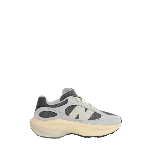 Image 1 of 5 - GREY - NEW BALANCE unisex design lace-up sneakerwith exaggerated proportions with the sculpted contours of a full-length FuelCell midsole and an array of wavy accents surrounding an understated knit upper.  FuelCell foam delivers a propulsive feel to help drive you forward. Features embroidered 'N' logo, medial stability post, sculpted, wavy outsole tread pattern. Material: knit, synthetic and wool blend mesh upper. 
