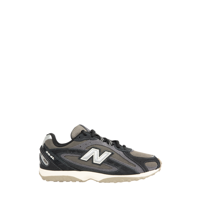 Image 1 of 5 - BLACK - NEW BALANCE 204L Sneaker featuring multi-piece upper with embossed overlay, screen-printed graphics along the saddle, distinctive outsole with 2000s-inspired strike path and 70s-influenced tread pattern, double-stacked suede 'N' logo and lace up closure. Premium suede upper. EVA outsole.
