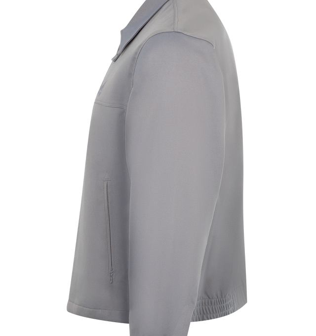 Image 3 of 3 - GREY - NEEDLES Sport Jacket featuring long sleeves, durable cavalry twill weave, classic collar, two-way zip closure, two zip front pockets, button cuffs, partially elasticated waistband and embroidered papillon logo at chest. 71% polyester, 24% rayon, 5% polyurethane.