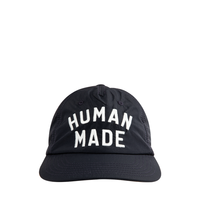 Image 1 of 2 - NAVY - HUMAN MADE 5 Panel Nylon Cap featuring a standard silhouette, thin, lightweight nylon fabric, soft brim, 5 panels, embroidered logo graphic on the front and rear adjuster for easy adjustments. 100% nylon.