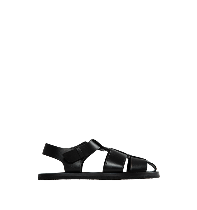 Image 1 of 4 - BLACK - THE ROW Fisherman Sandal featuring seamless strap construction and covered adjustable buckle closure. 100% Leather. Rubber sole. Made in Italy. 