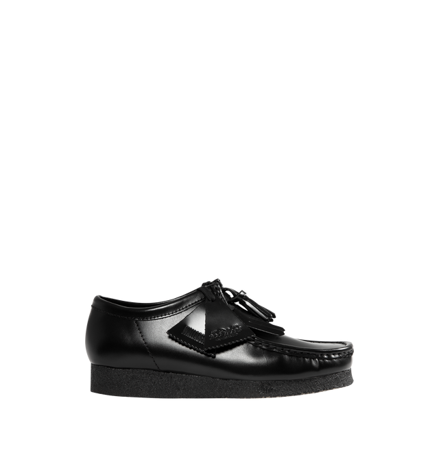 Image 1 of 4 - BLACK - CLARKS Wallabee Hi Shine Leather Shoe featuring dress leather uppers, lace tassels, three FOBS Clarks Originals, kiltie FOB and 200 years FOB, removable tonal kiltie, natural pebble crepe with a black sole spray, Clarks Originals heat embossed logo on sock, moccasin construction and hand stitched apron seam.