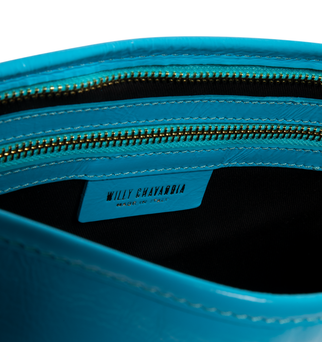 Image 3 of 3 - BLUE - WILLY CHAVARRIA Chilango Clutch featuring a gold zipper closure, fully lined interior, subtle logo embossing and refined edge stitching. 11 W x 7 H x 3.5 D in. Leather. Made in Italy.