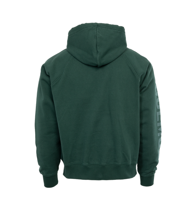 Image 2 of 4 - GREEN - JACQUEMUS LE HOODIE TYPO is a long sleeve logo hoodie with a classic fit, adjustable drawstring hood, raglan sleeves, engraved circle, square tips, tone-on-tone logo on right sleeve, side seam pockets, ribbed cuffs and back hem. 100% cotton 