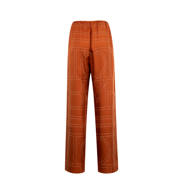 Image 2 of 3 - ORANGE - TOTEME Monogram Silk PJ Bottoms featuring mid-weight, fluid silk twill, embroidered with a fine monogram pattern, relaxed, straight-leg silhouette, elasticated waistband and side pockets. 100% silk.
