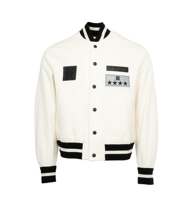 Image 1 of 3 - WHITE - GIVENCHY Varsity Jacket featuring GIVENCHY, 4G labels and reflective 4G Stars patch on the front, ribbed elasticated knit collar, cuffs and hem with contrasting stripes, snap closure, two side pockets and classic fit. 100% virgin wool. Details: 100% calfskin leather. Made in Portugal. 