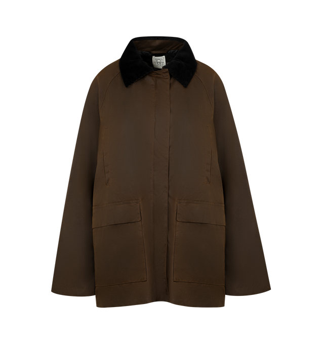 Image 1 of 3 - BROWN - Toteme oversized jacket made from waxed cotton sourced from British heritage weavers and dyed in a new brown shade named bark. It has a very spacious A-line silhouette accented with a black corduroy collar and elbow patches, a zipper and press-stud front, multiple front pockets, and two back vents. 100% cotton organic; lining: 100% viscose; filling: 100% polyester. Made in Romania.