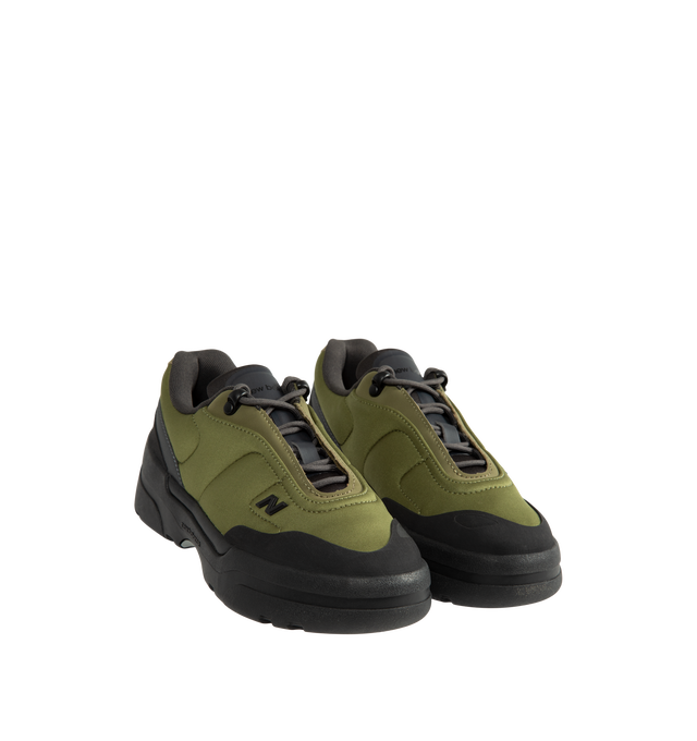 Image 2 of 5 - GREEN - New Balance Unisex TL900 is crafted with a suede and mesh upper and features a trail walking-inspired design that draws from New Balance's outdoor heritage. This modern update to a classic trail walking boot balances everyday comfort with rugged versatility, while a contemporary hardware N logo adds a distinctive finishing touch. Designed for daily wear and outdoor exploration alike, the silhouette delivers a supportive and comfortable feel throughout the day. Upper: Suede and Mesh. W