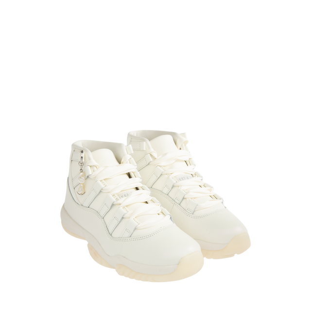 Image 2 of 5 - WHITE - JORDAN Air Jordan 11 Retro Sneaker featuring patent leather upper, lace-up front, foam midsole, Air cushioning, rounded toe, pearl charm and rubber outsole.