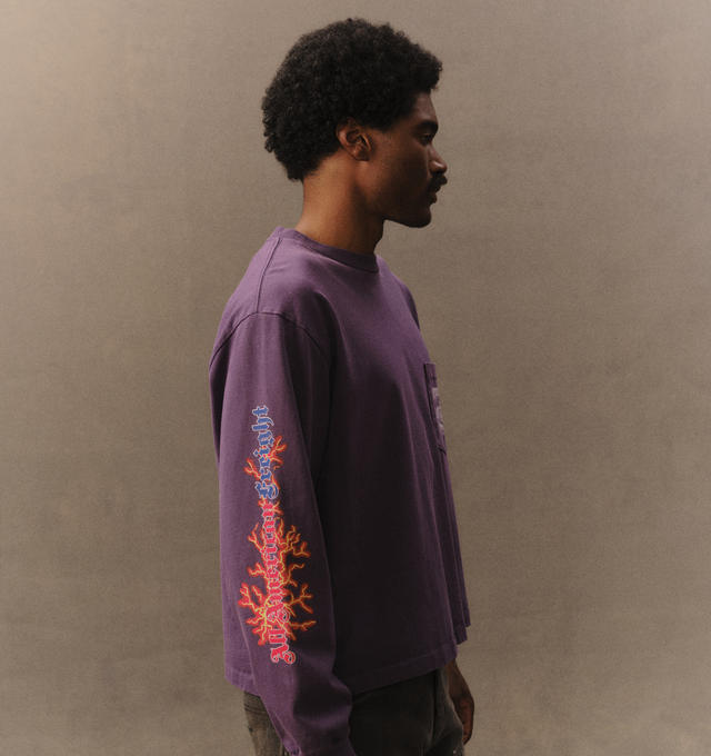 Image 5 of 6 - PURPLE - Cherry LA Men's American Freight Longsleeve T-Shirt is crafted from heavyweight cotton and features a boxy-fit silhouette with long sleeves and rib-knit cuffs. Designed with screen-printed graphics at the front, back, and sleeves, this statement style combines durable construction with bold Cherry LA artwork. Main Material: Heavyweight Cotton. Made in Los Angeles, California.