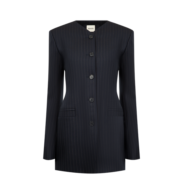 Image 1 of 2 - NAVY - KHAITE Naran Jacket featuring a collarless, high-necked jacket shaped by sleek lines, reinforced shoulder pads, functional welt pockets, single-breasted silhouette designed to fit long and lean and lined in cupro twill. 96% virgin wool, 2% elastane, 2% cotton.
