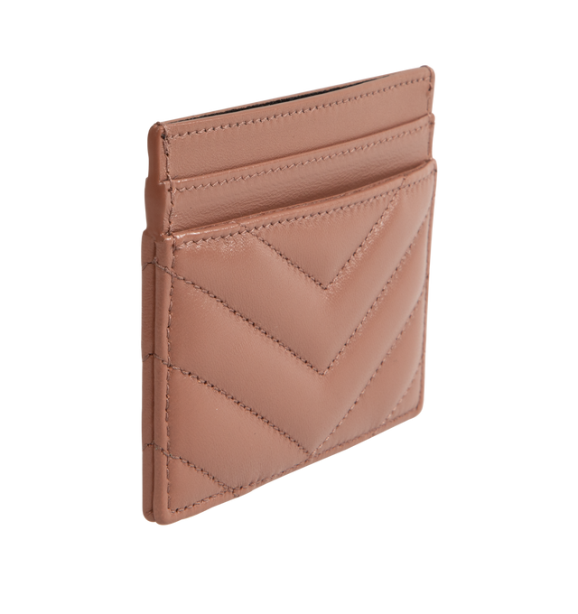 Image 2 of 3 - BROWN - SAINT LAURENT Monogram Card Case featuring five card slots, gold tone hardware, cassandre and chevron-quilted overstitching. 4 X 2.8 X 0.1 inches. 100% lambskin. Made in Italy.