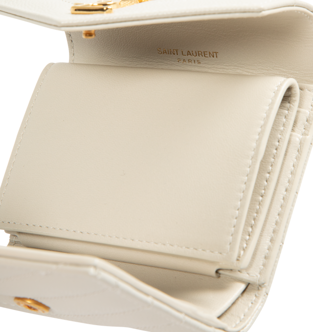 Image 3 of 3 - WHITE - SAINT LAURENT Multi Folded Wallet featuring logo on front, quilted overstitching, gold-toned metal hardware, snap button closure, five card slots, one coin pocket, one bill compartment, one receipt compartment and leather lining. 3.9 x 3.5 x 1.2 inches. Calfskin. Made in Italy.