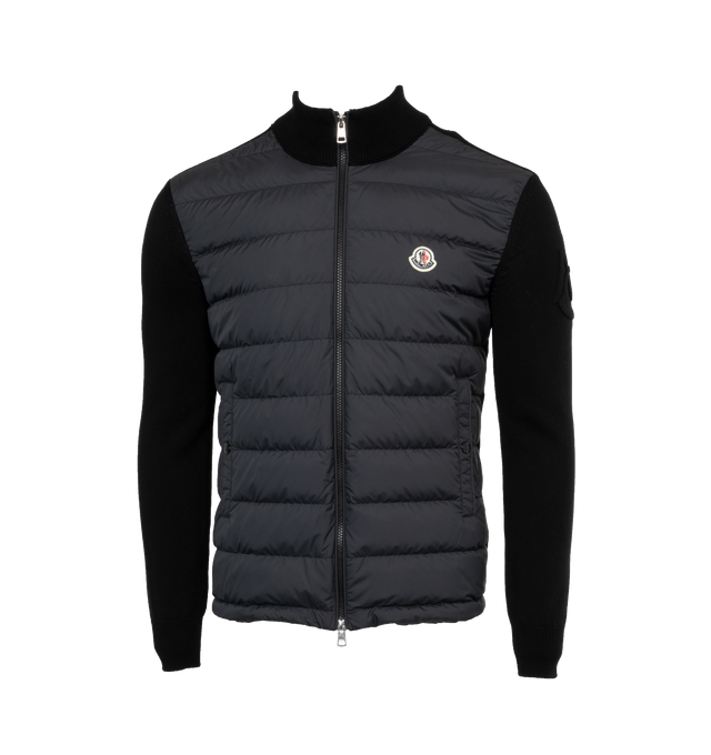 Image 1 of 3 - BLACK - MONCLER Padded Cardigan featuring lightweight micro chic lining, down-filled, stocking stitch, Gauge 7, zipper closure, vertical welt pockets with snap button closure and embossed embroidery. 100% polyester. 100% cotton. Padding: 90% down, 10% feather.