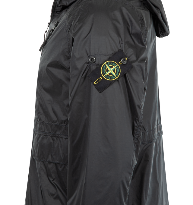 Image 3 of 3 - BLACK - STONE ISLAND featuring hood with visor and elasticated drawcord at contour and back, shaped front yoke with raglan sleeves, angled chest pocket with zipper, bellows hand pockets with flap and concealed double snap, vents on back, Stone Island badge on left sleeve, elasticated cuffs, elasticated drawcord at hem and two-way zipper fastening. 100% polyamide/nylon.