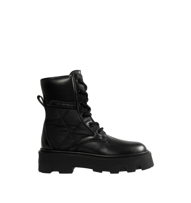 Image 1 of 5 - BLACK - Moncler Womens Aurea Ankle Boots are crafted from leather with polyamide and nylon accents and feature a round toe, lace-up closure, leather lining, and a durable elastodiene sole. These designer ankle boots combine a classic lace-up silhouette with performance-inspired detailing for versatile everyday wear. Main Material: Leather, Polyamide, Nylon; Lining: Leather; Sole: Elastodiene. Made in Italy.