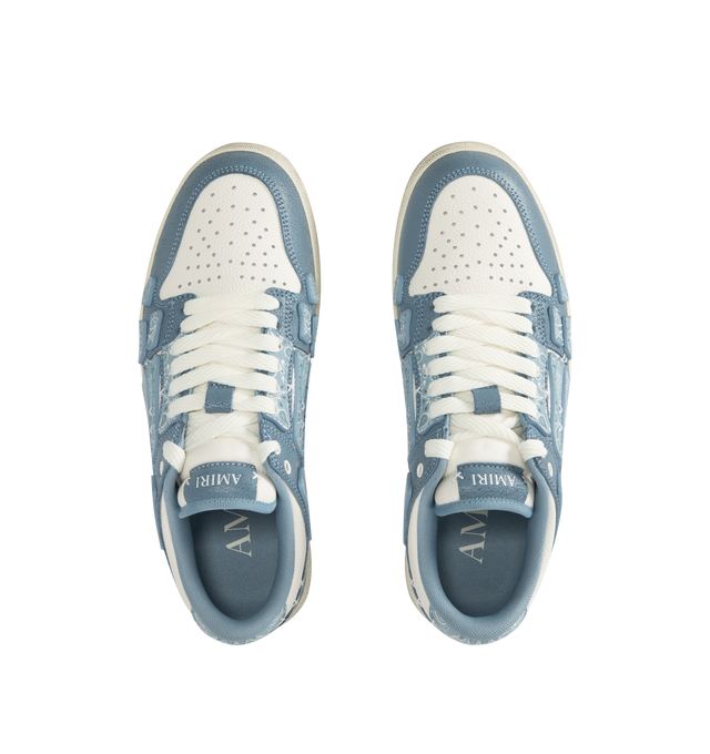 Image 5 of 5 - BLUE - AMIRI Bandana Skel Top Low Sneakers featuring low-top, buffed leather, logo pattern embossed throughout, perforated detailing at toe, lace-up closure, logo patch at padded tongue, padded collar, bandana print appliqus at sides and treaded rubber sole. Upper: leather. Sole: rubber.