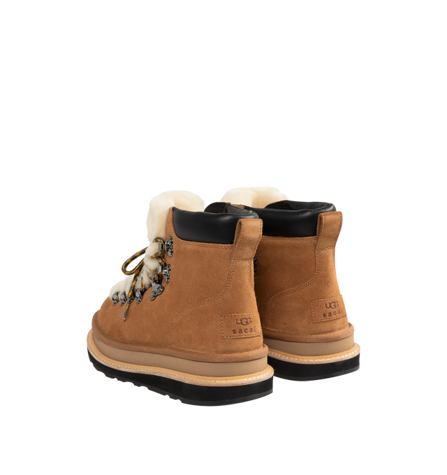 Image 3 of 4 - BROWN - UGG x sacai hiker boots designed for everyday wear, combines UGG's iconic premium  suede with sacai's unmistakable hybridized aesthetic. Upper is made with suede sourced from certified farms that practice regenerative agriculture upper. Midsole incorporates sugarcane EVA. Features Vibram XS Trek Evo. Unisex style in women's sizes.
