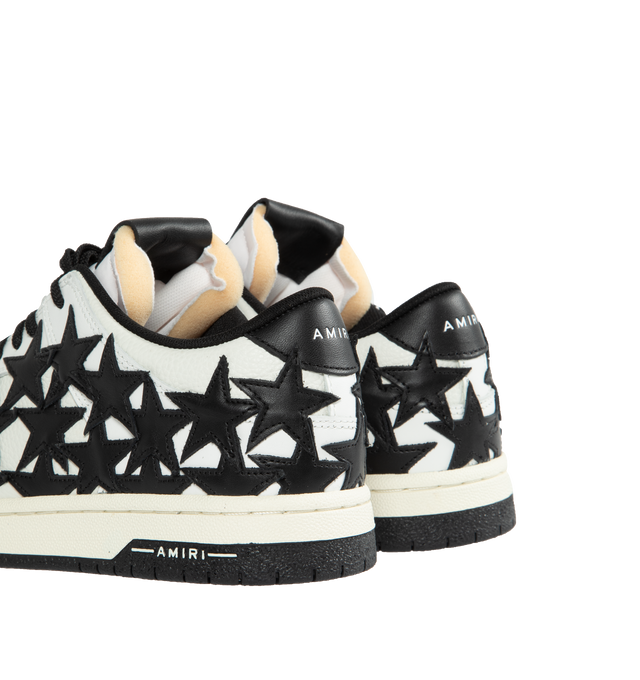 Image 3 of 5 - BLACK - AMIRI Stars Leather Low-Top Sneakers featuring flat heel, round toe, logo on the tongue and heel, lace-up vamp, star clusters on the side and rubber outsole. 