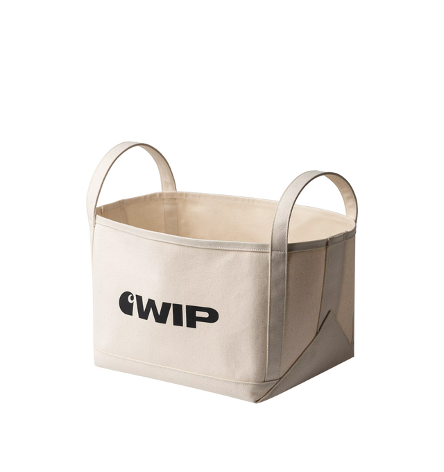Image 1 of 2 - NEUTRAL - Carhartt WIP Magazine Canvas Basket is crafted from coated cotton canvas and features a structured storage silhouette with two top handles and durable triple-stitched construction. Designed for organizing magazines, books, and everyday essentials, this versatile basket is finished with graphic logo lettering for a signature Carhartt WIP touch. Main Material: 100% Cotton Canvas, 500 gsm. Dimensions: 33 x 25 x 25 cm / 13.0 x 9.8 x 9.8 in. Handles: Dual Top Handles. Details: Coated Can