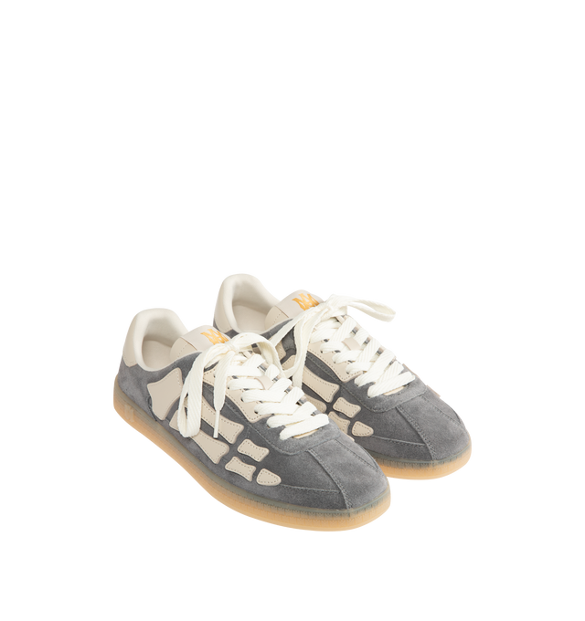 Image 2 of 5 - GREY - AMIRI Pacific Bones Sneakers in suede featuring low-top, signature bone appliqus on the sides, flat heel, round T-toe, lace-up vamp, woven MA tongue label, backstay logo and rubber outsole.