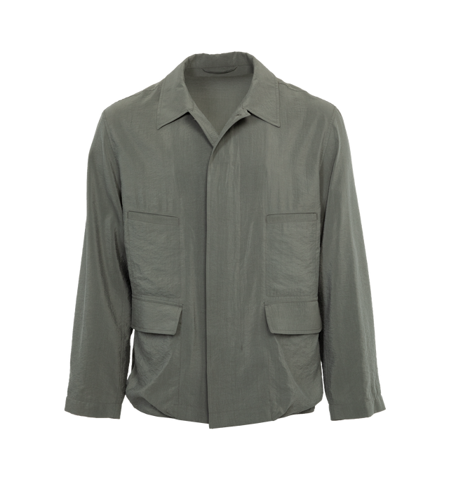 Image 1 of 3 - GREY - LEMAIRE 4 Pocket Overshirt in Dry Silk featuring loose fit, corozo buttons, buttoned cuffs, two flap pockets and two piped pockets. 76% silk, 24% polyamide/nylon. 