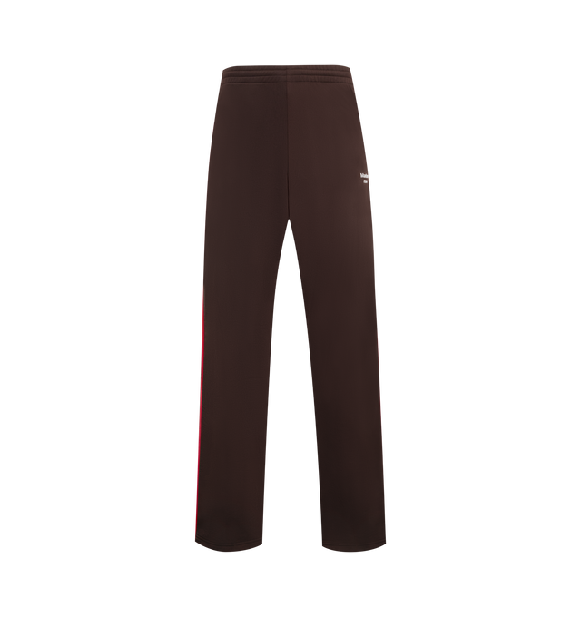 Image 1 of 3 - BROWN - MARTINE ROSE Wide Leg Track Pants featuring fleece track pants, concealed drawstring at elasticized waistband, two-pocket styling, logo embroidered at front and stripe appliqus and piping at outseams. 100% polyester. Made in Portugal.