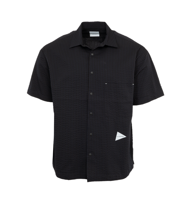 Image 1 of 4 - NAVY - AND WANDER 64 Dry Soft Seersucker Shirt featuring front snap button closure, a front patch pocket, and two inseam pockets. 60% polyester, 40% cotton. 