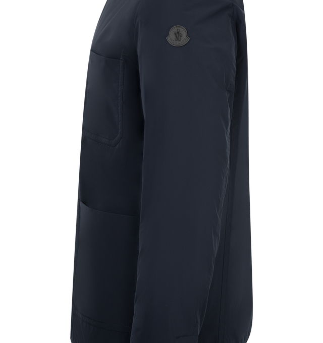Image 4 of 4 - NAVY - Moncler Monges Jacket has a band collar, a snap button front closure, snap button cuffs, front patch pockets, and a chest patch pocket. 90% down, 10% feathers. 100% polyester.