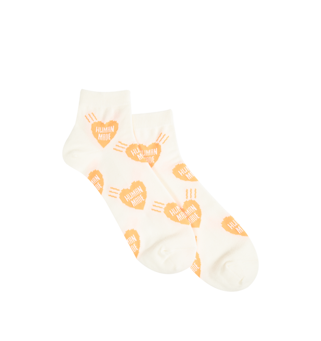 Image 1 of 2 - ORANGE - HUMAN MADE Heart Socks featuring short length, soft, comfortable cotton blend, all-over heart logo patter, ribbed top cuff and jacquard weave logo. 47% cotton, 20% nylon, 20% acrylic, 11% polyester, 2% spandex.