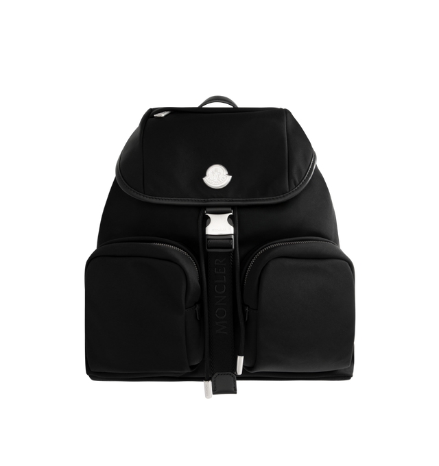 Image 1 of 3 - BLACK - MONCLER New Trick Backpack featuring recycled water-repellent nylon, nylon lining, leather trim, leather handle, adjustable straps, closure with buckle and drawstring fastening, zipped pockets and inner media pocket. L 17 cm x H 18 cm x D 10 cm. 100% polyester. Made in Italy.