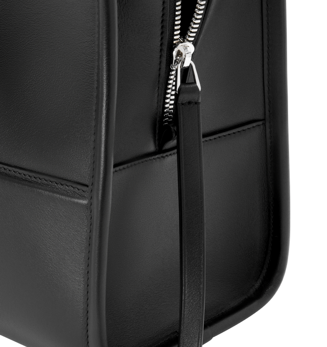 Image 9 of 16 - BLACK - Loewe Amazona 180 large bag takes on a relaxed silhouette anchored by a single toron top handle. It is designed to be carried open, while a concealed closure secures the main compartment. Removable shoulder and crossbody straps make it highly versatile. This large version is crafted in soft calfskin. Three carry options: short handle, removable shoulder strap and crossbody. Features zip closure with two leather zip pullers, two compartments, main compartment closed with magnetic clos