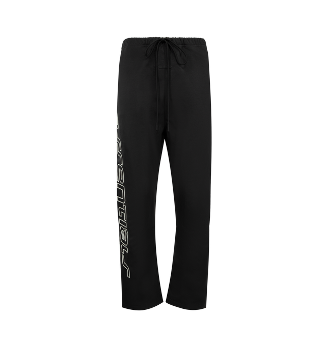 Image 1 of 4 - BLACK - FEAR OF GOD ESSENTIALS Active Trace Relaxed Drawstring Pant featuring drawstring waistband, side seam pockets, rubberized logo patch and midweight ripstop fabric. 100% nylon.