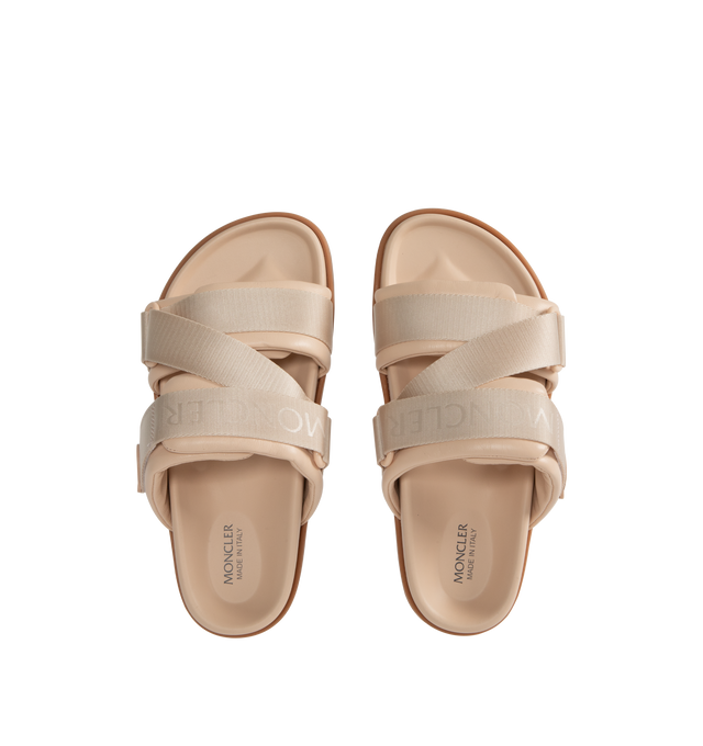 Image 4 of 4 - NEUTRAL - MONCLER Mon Summer Leather Crisscross Sandals featuring crisscross logo-stamped polyester strap, flat heel, dual band upper, slip-on style, molded footbed, rubber outsole. Lining: leather. Made in Italy.