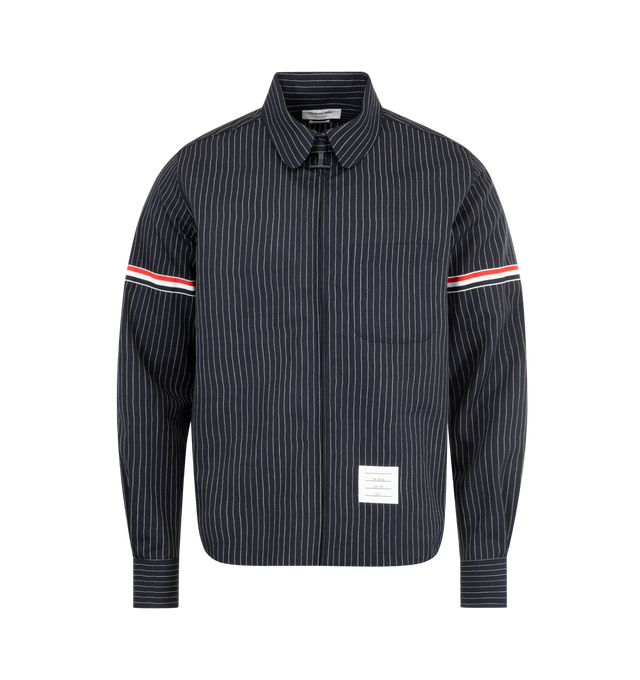 Image 1 of 2 - NAVY - THOM BROWNE Pinstriped Wool Suiting Shirt featuring a pinstriped motif, a suiting-inspired silhouette, spread collar, patch pocket at the chest, striped bands, long sleeveswith button cuffs and front zip closure. 97% virgin wool, 3% polyester.