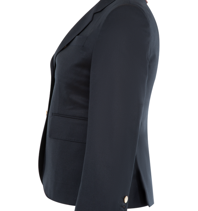 Image 3 of 3 - NAVY - Thom Browne Women's wool single-breasted blazer featuring signature grosgrain loop tab, three stripe lining, notched lapels, front 3-button fastening, long sleeves, chest welt pocket, two side flap pockets, buttoned cuffs and English rear vents. 120's Twill Fabric. 100% Wool, Lining: 100% Cupro. Made in Italy.