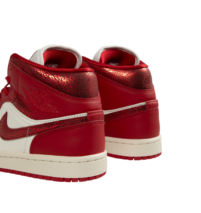 Image 3 of 5 - RED - JORDAN Air Jordan 1 Mid SE Sneaker featuring genuine leather in the upper, Nike Air technology, soft foam in the midsole, rubber in the outsole, wings logo on collar and Jumpman on tongue.