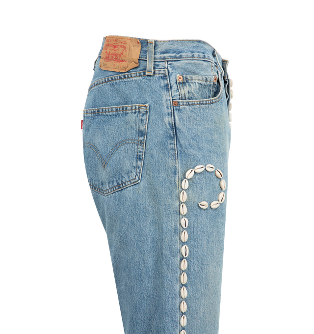 Image 3 of 3 - BLUE - BARRIERS Cowrie Shell Denim Shorts featuring upcycled 501 Levis, distressed throughout, five-pocket styling and hand embellished. 100% cotton. Made in USA.